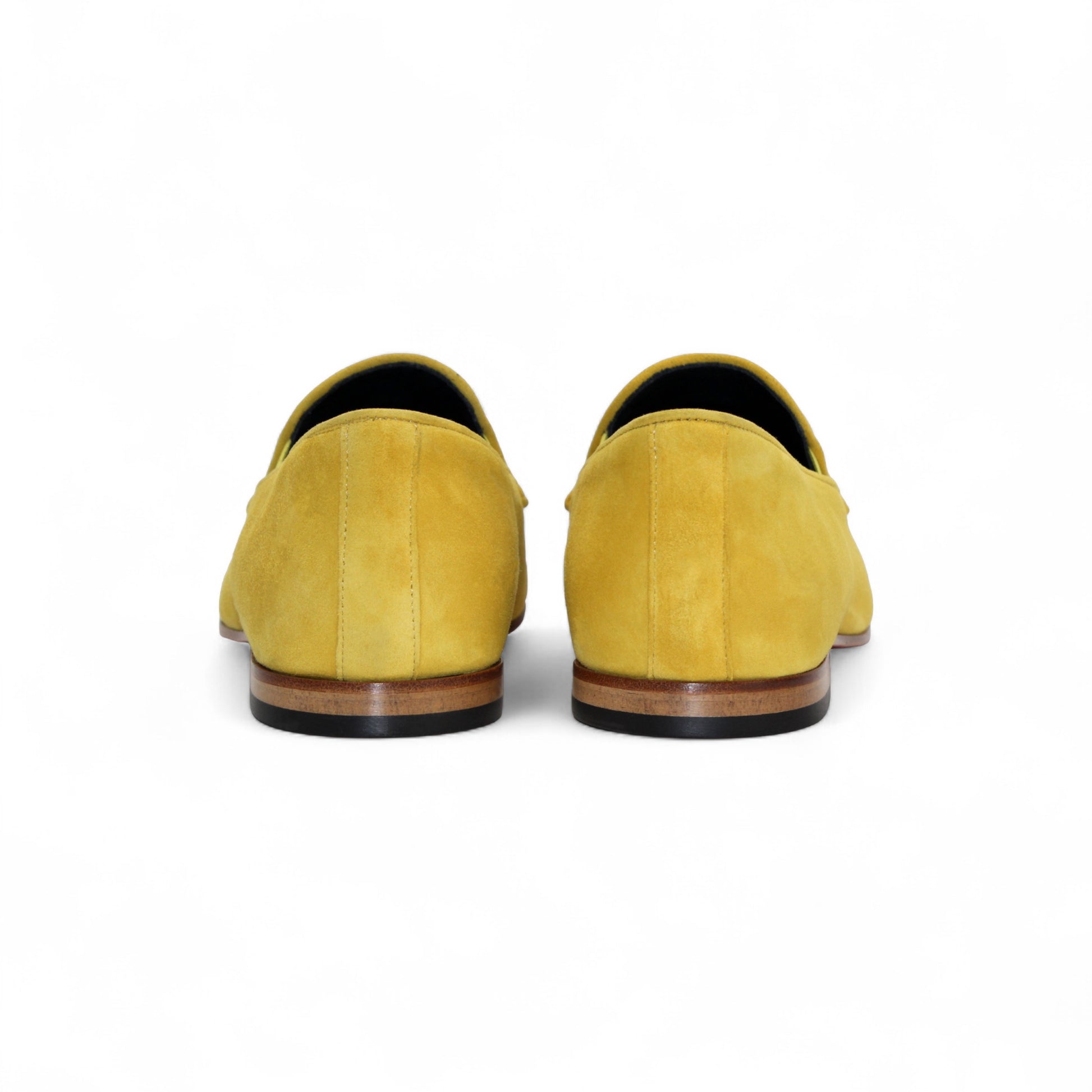 The Duca Di Matiste Duca Anzio Yellow is a single yellow suede loafer made in Italy, featuring a tassel detail, low wooden heel, and stitched trim, shown in profile against a white background.