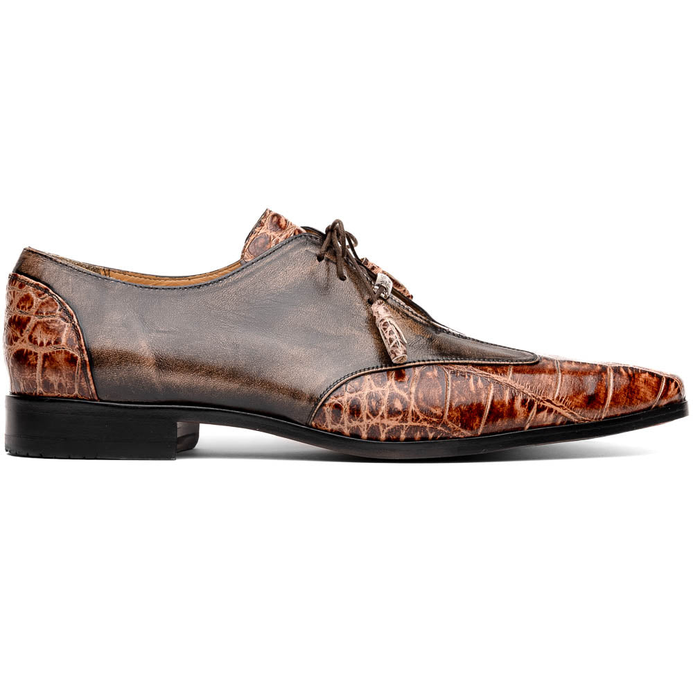 A pair of Anzio Rustic Orix brown leather dress shoes by Marco Di Milano, featuring a textured crocodile pattern—one upright, the other showing a smooth tan sole—represent true luxury men's footwear.