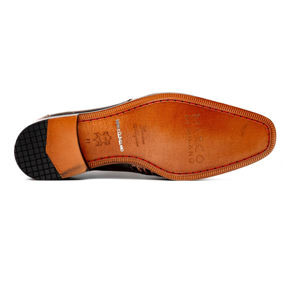 A pair of Anzio Rustic Orix brown leather dress shoes by Marco Di Milano, featuring a textured crocodile pattern—one upright, the other showing a smooth tan sole—represent true luxury men's footwear.