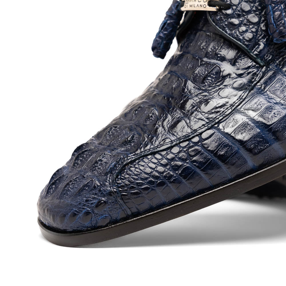 A pair of Marco Di Milano Apricena Midnight Blue caiman crocodile derby shoes, one upright and the other on its side showing the sole, with black laces for a luxury dress look.