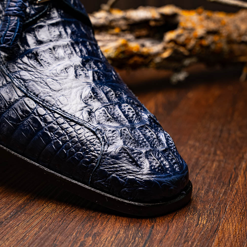 A pair of Marco Di Milano Apricena Midnight Blue caiman crocodile derby shoes, one upright and the other on its side showing the sole, with black laces for a luxury dress look.