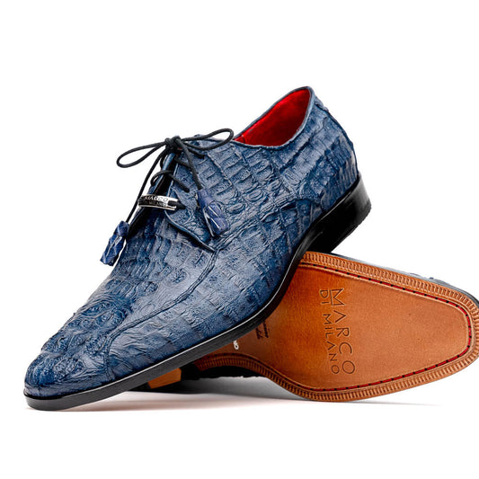 The Apricena Navy by Marco Di Milano are blue textured luxury men's dress shoes with black laces, red interior lining, and branded tan leather soles—crafted to evoke the refined look of genuine caiman crocodile shoes.