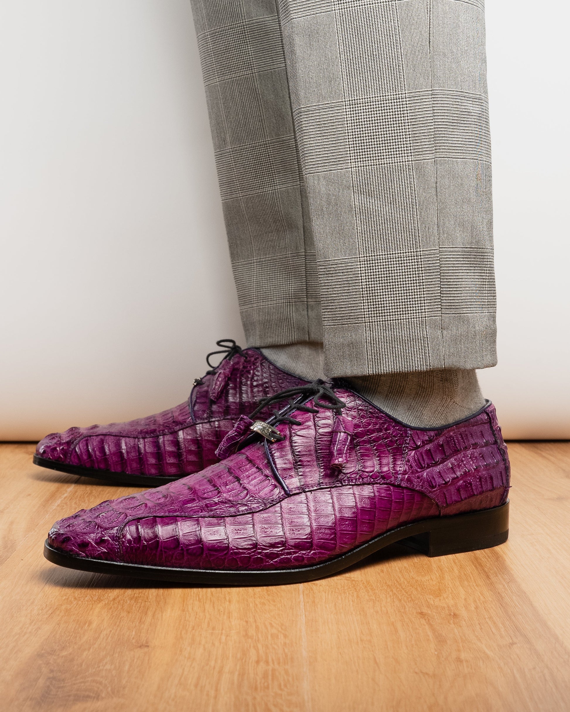 The Marco Di Milano Apricena Purple shoes feature genuine caiman crocodile leather, black laces, and a polished finish—one upright and one showing the sole—making them an exquisite luxury derby choice.