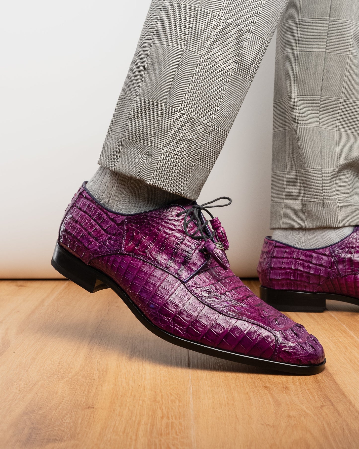 The Marco Di Milano Apricena Purple shoes feature genuine caiman crocodile leather, black laces, and a polished finish—one upright and one showing the sole—making them an exquisite luxury derby choice.