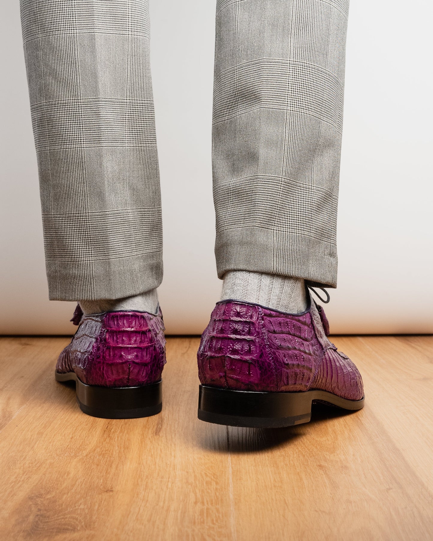 The Marco Di Milano Apricena Purple shoes feature genuine caiman crocodile leather, black laces, and a polished finish—one upright and one showing the sole—making them an exquisite luxury derby choice.