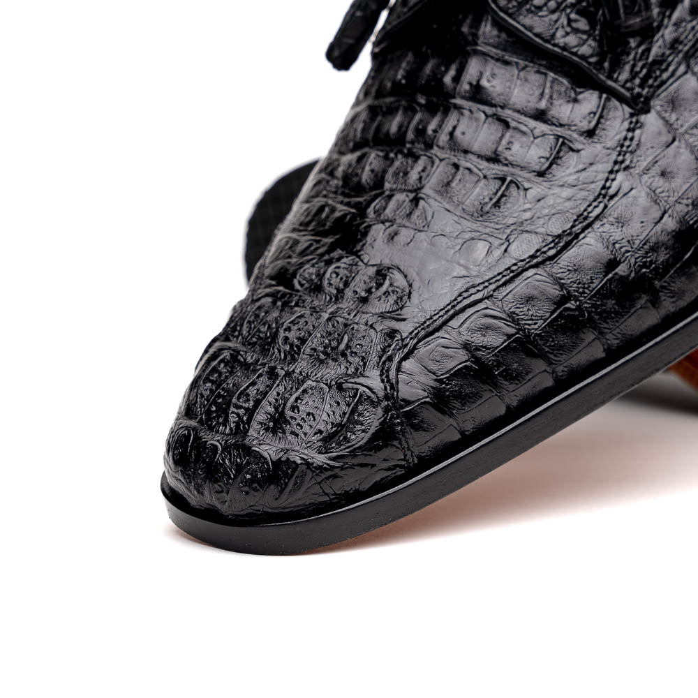 A pair of Marco Di Milano Apricena Black luxury men's dress shoes in genuine caiman crocodile leather with red interior lining and tan leather soles—one upright, the other lying stylishly on its side.