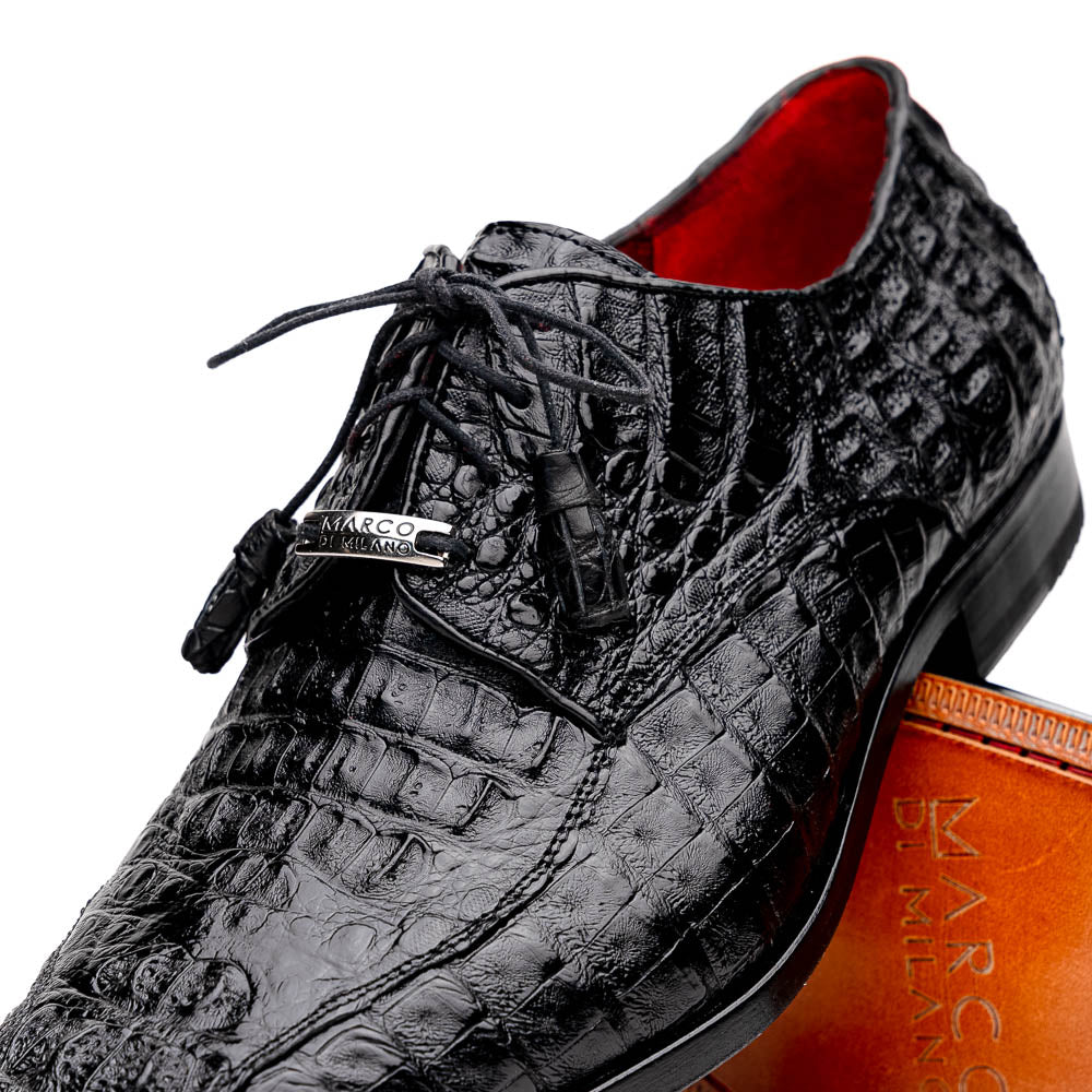 A pair of Marco Di Milano Apricena Black luxury men's dress shoes in genuine caiman crocodile leather with red interior lining and tan leather soles—one upright, the other lying stylishly on its side.