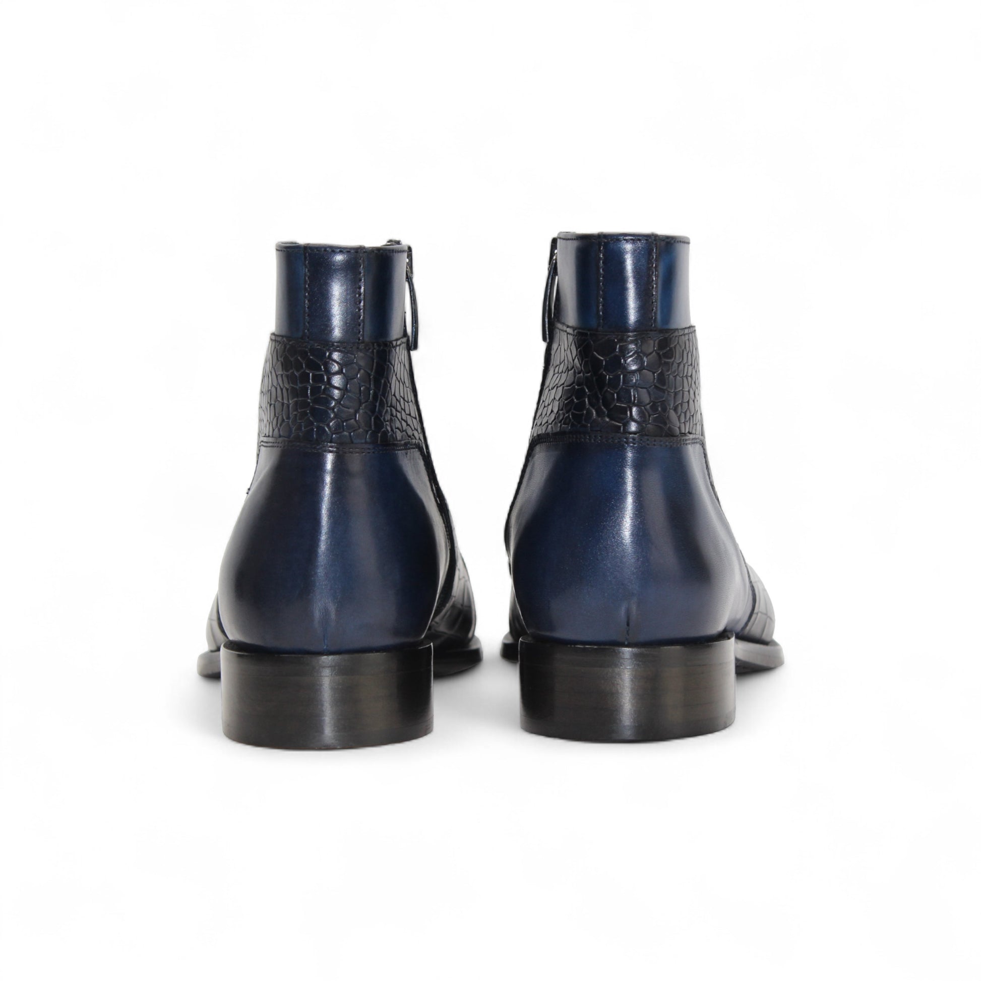 The Duca Di Matiste Duca Aprilia Navy is a genuine leather ankle boot in blue with black textured overlays, a low heel, and almond-shaped toe, shown on a white background.