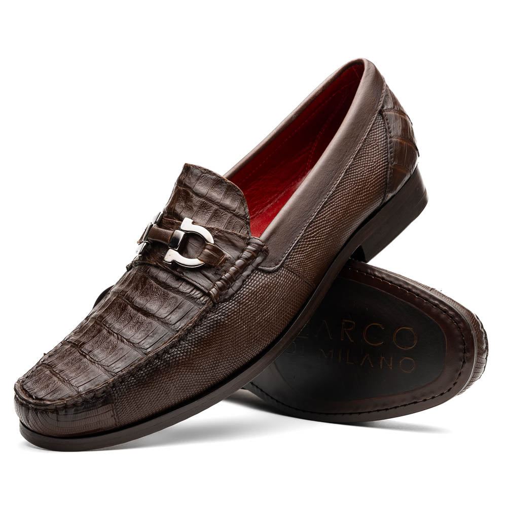 Introducing the Adro Brown by Marco Di Milano—crafted in brown leather with crocodile texture, silver buckle, red interior lining, and signature sole logo. A luxurious choice for those who value genuine exotic design.