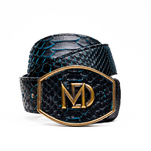 The Arkansas Belt Black / Blue by Marco Di Milano features a handcrafted black snakeskin pattern and a gold and black "MD" buckle, displayed against a white background.