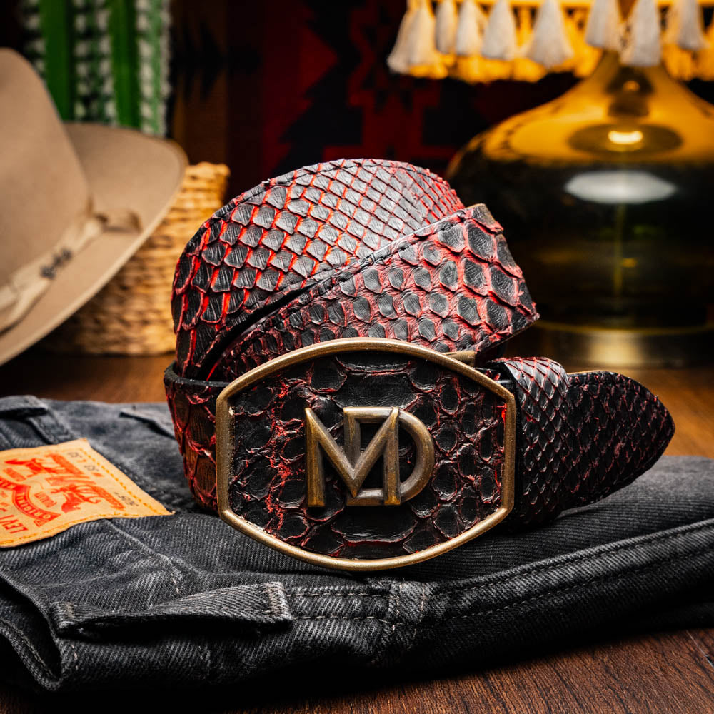 The Arkansas Belt BlackCherry by Marco Di Milano is a black and red genuine python skin western belt with a gold "MD" buckle on a white background.