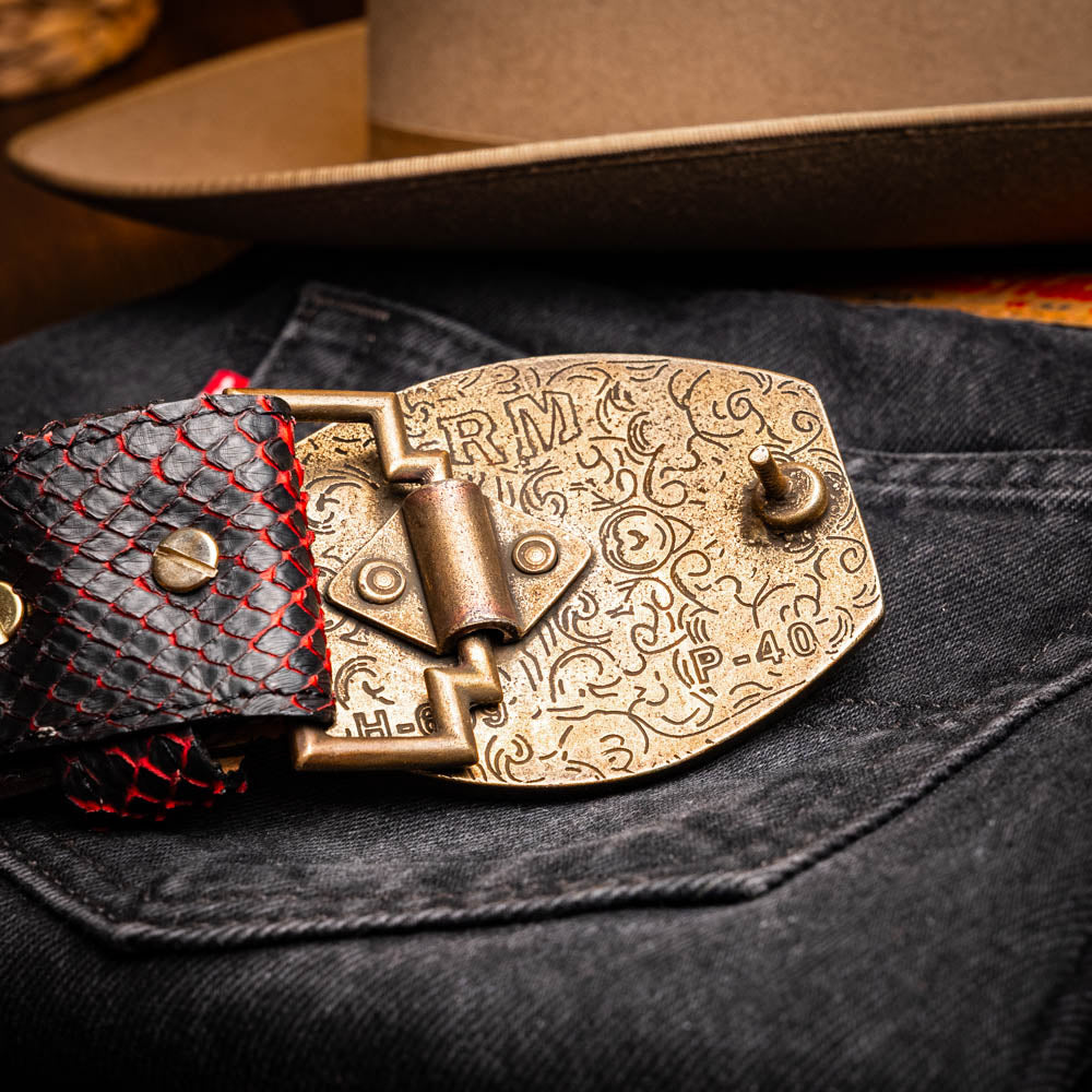 The Arkansas Belt BlackCherry by Marco Di Milano is a black and red genuine python skin western belt with a gold "MD" buckle on a white background.