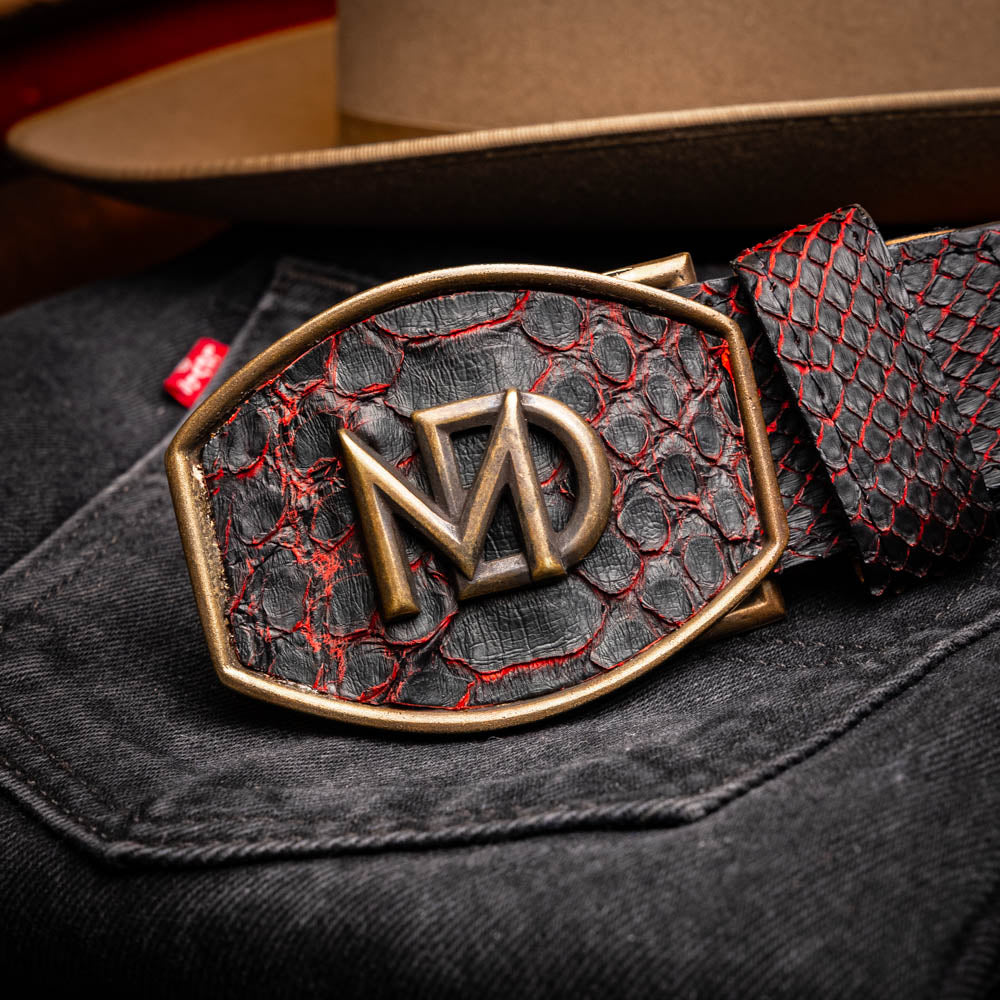 The Arkansas Belt BlackCherry by Marco Di Milano is a black and red genuine python skin western belt with a gold "MD" buckle on a white background.
