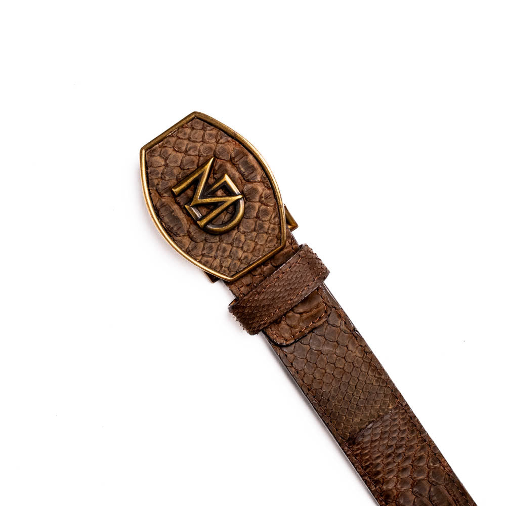 The Arkansas Belt Brown by Marco Di Milano is a handcrafted western accessory in genuine python skin, featuring a gold-tone buckle with overlapping "M" and "D" letters.