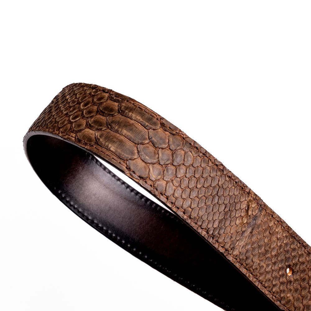 The Arkansas Belt Brown by Marco Di Milano is a handcrafted western accessory in genuine python skin, featuring a gold-tone buckle with overlapping "M" and "D" letters.