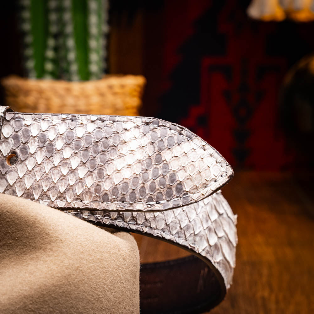 The Arkansas Belt Natural by Marco Di Milano is a handcrafted exotic accessory with a snakeskin pattern and a bold gold "MD" logo buckle at the center.
