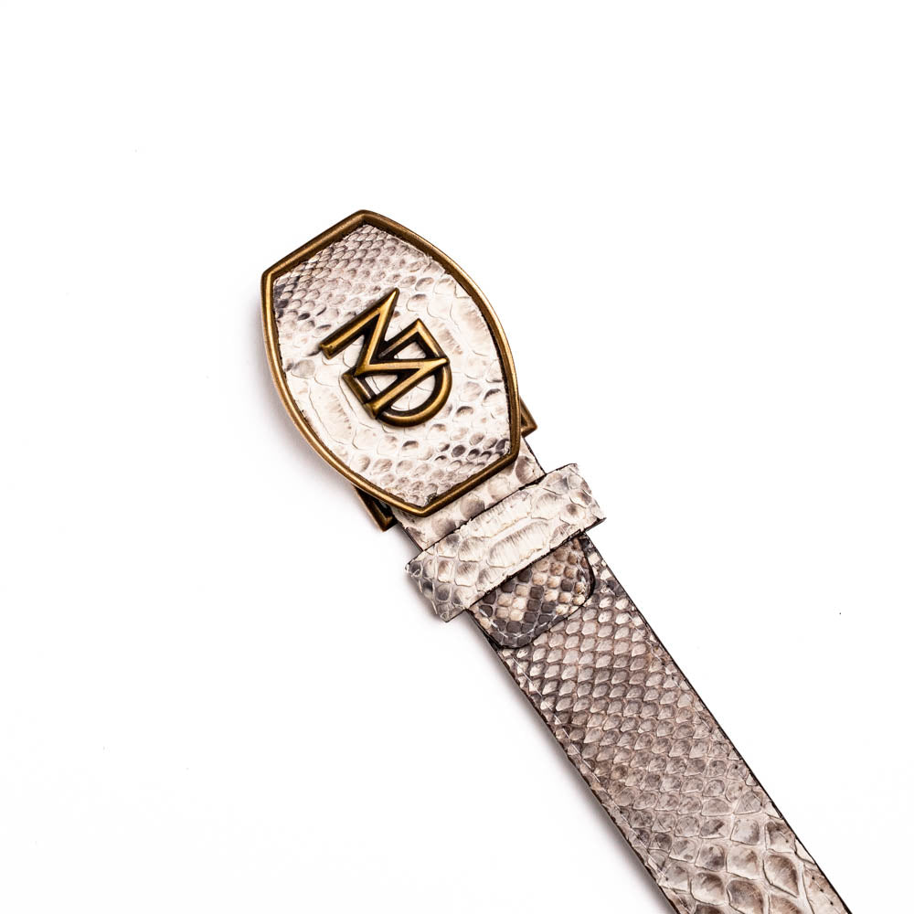 The Arkansas Belt Natural by Marco Di Milano is a handcrafted exotic accessory with a snakeskin pattern and a bold gold "MD" logo buckle at the center.
