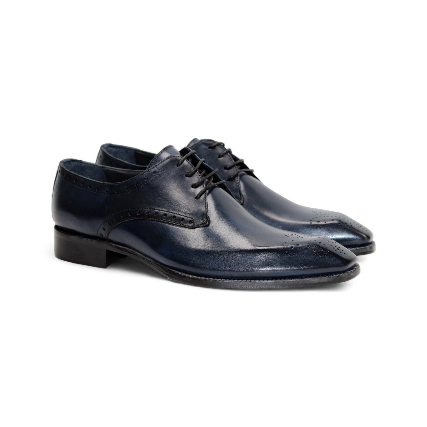 The Duca Arpino Navy by Duca Di Matiste is an Italian leather dress shoe in navy blue, featuring brogue details, a rounded toe, and a black sole, displayed in side profile against a white background.
