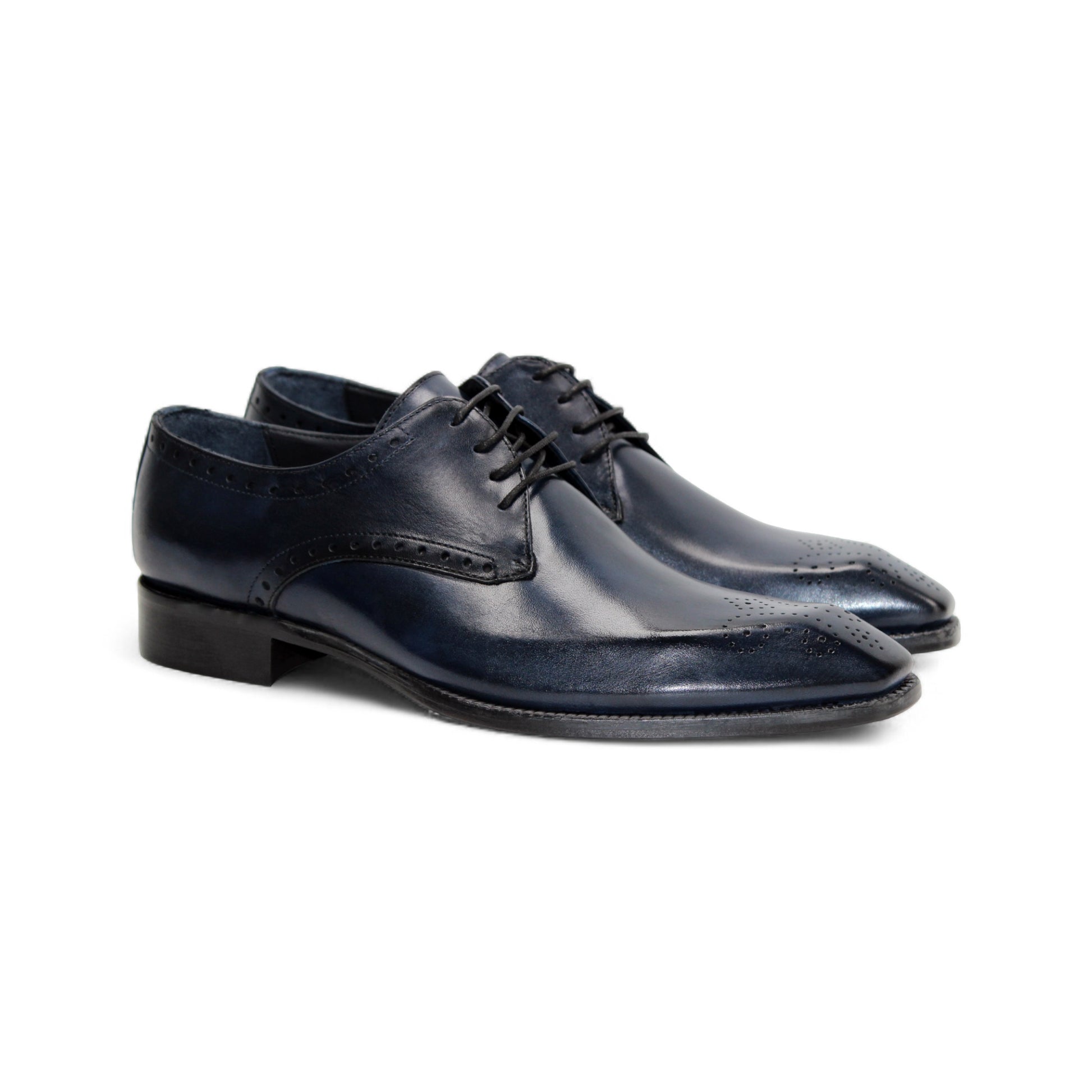 The Duca Arpino Navy by Duca Di Matiste is an Italian leather dress shoe in navy blue, featuring brogue details, a rounded toe, and a black sole, displayed in side profile against a white background.