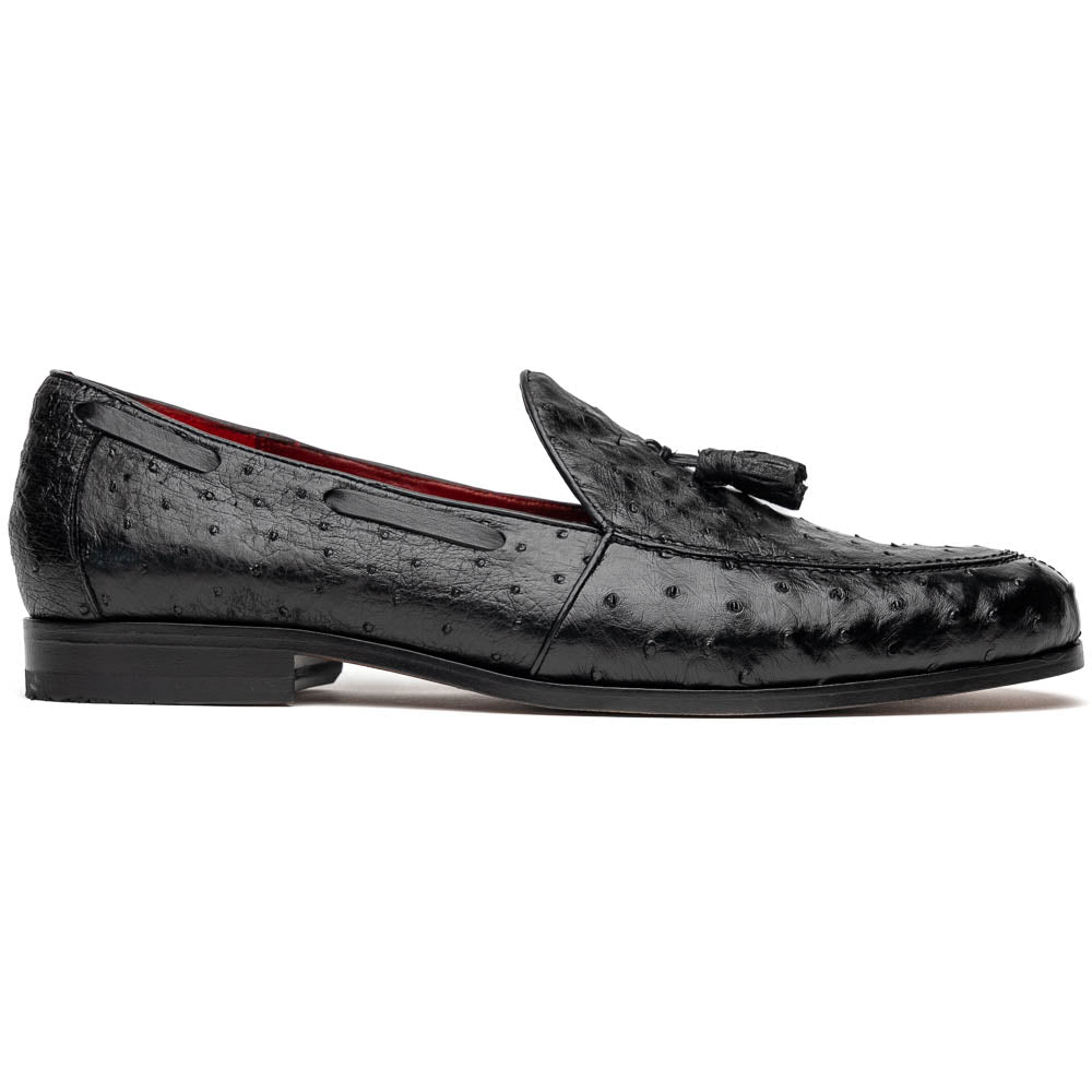 The Aubiere Black by Marco Di Milano are luxury men's tassel loafers in black genuine ostrich leather, shown with one shoe upright and the other displaying a tan sole embossed with the Marco Di Milano logo.