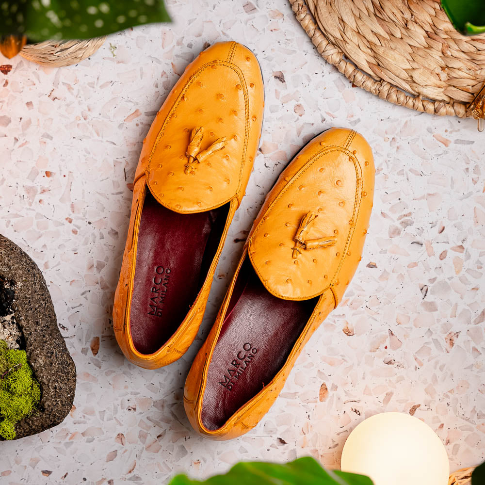 The Aubiere Buttercup by Marco Di Milano are yellow ostrich tassel loafers with red interior lining and branded leather soles, expertly crafted from genuine ostrich, presented against a white background.
