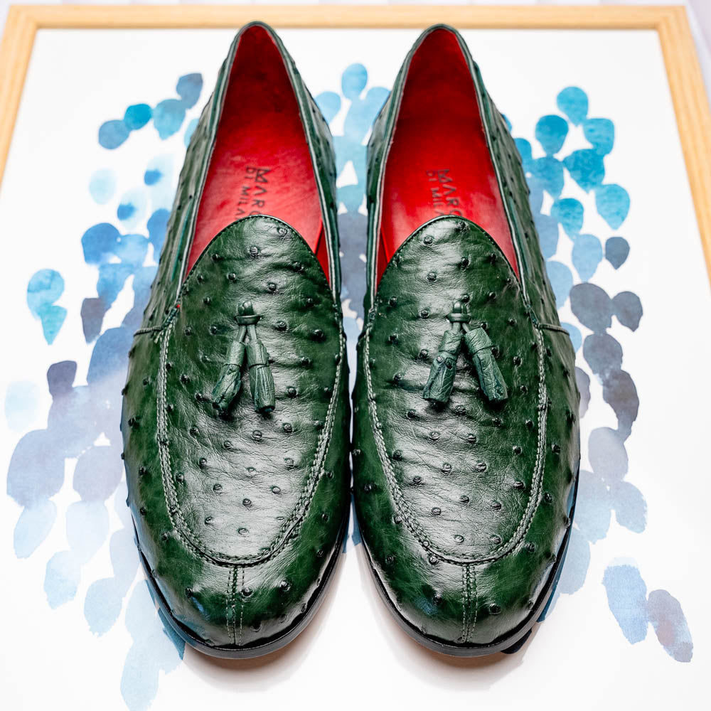 The Marco Di Milano Aubiere Forest Green features luxury ostrich tassel loafers with genuine quill texture, red interior lining, and tan leather soles.