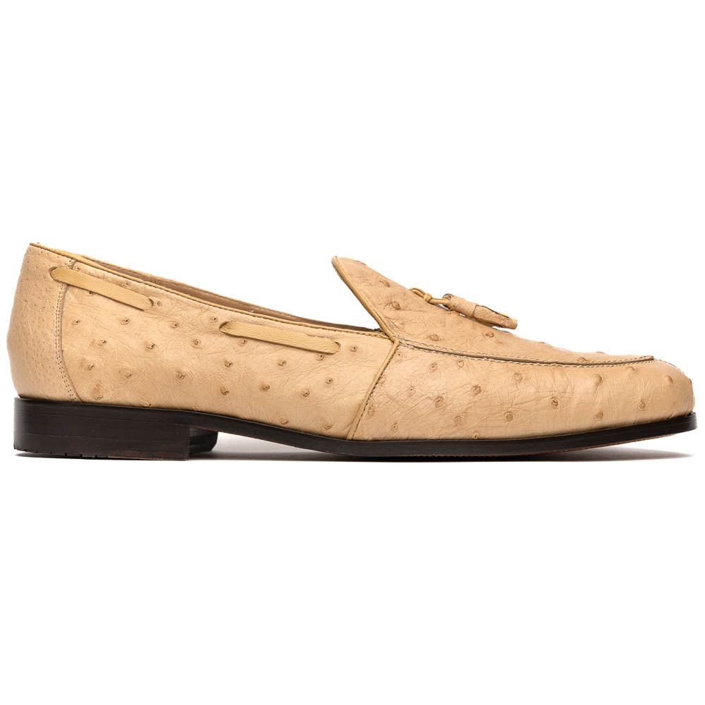 The Aubiere Orix by Marco Di Milano features beige ostrich tassel loafers—one upright, one showing the stitched brown leather sole—ideal for luxury men’s footwear enthusiasts.