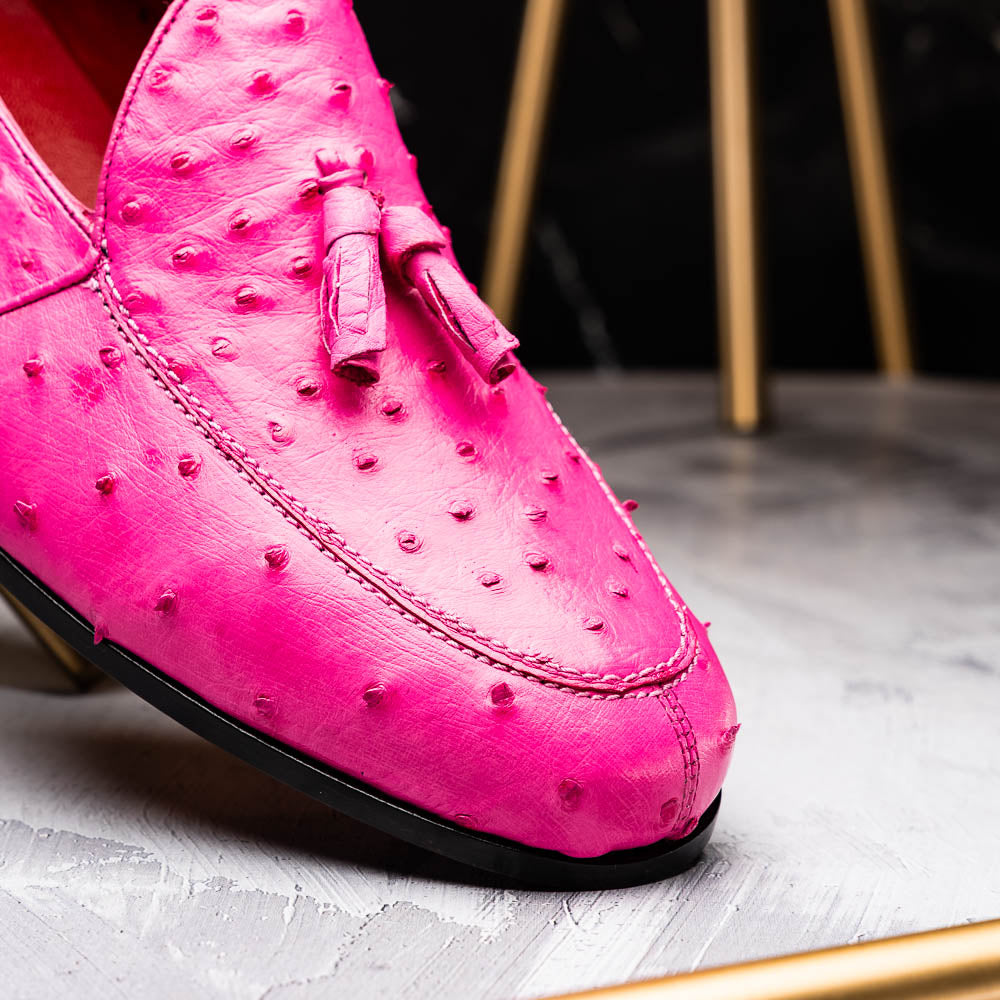 Aubiere Pink by Marco Di Milano: genuine ostrich quill men's tassel loafers in bright pink, with one shoe upright and the other displaying the sole—luxurious footwear that makes a statement.