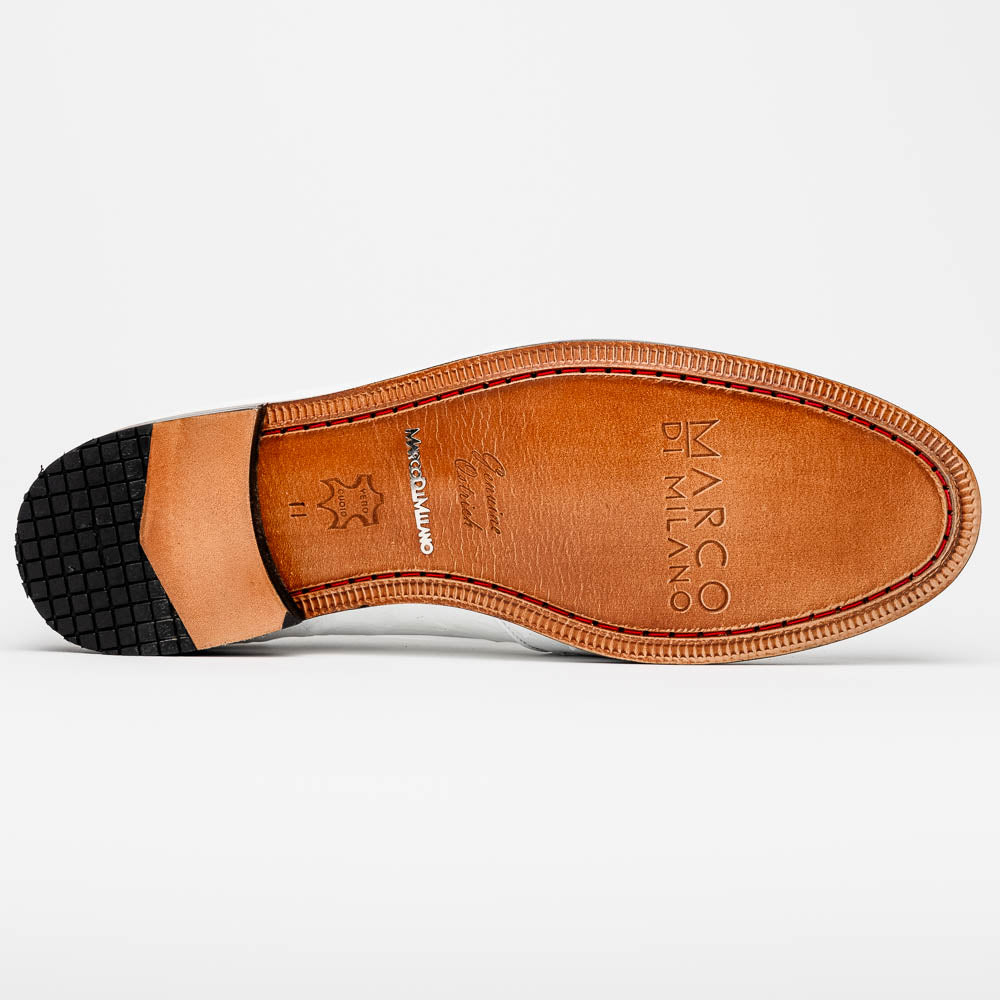 A pair of luxury men’s loafers—Marco Di Milano Aubiere White—crafted in textured white leather with ostrich tassels, red interior lining, tan soles; one shoe rests on its side showing the “Marco Di Milano” logo.