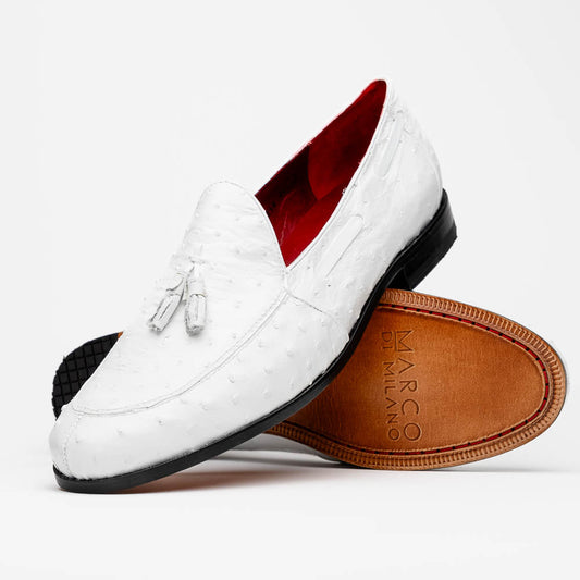 A pair of luxury men’s loafers—Marco Di Milano Aubiere White—crafted in textured white leather with ostrich tassels, red interior lining, tan soles; one shoe rests on its side showing the “Marco Di Milano” logo.