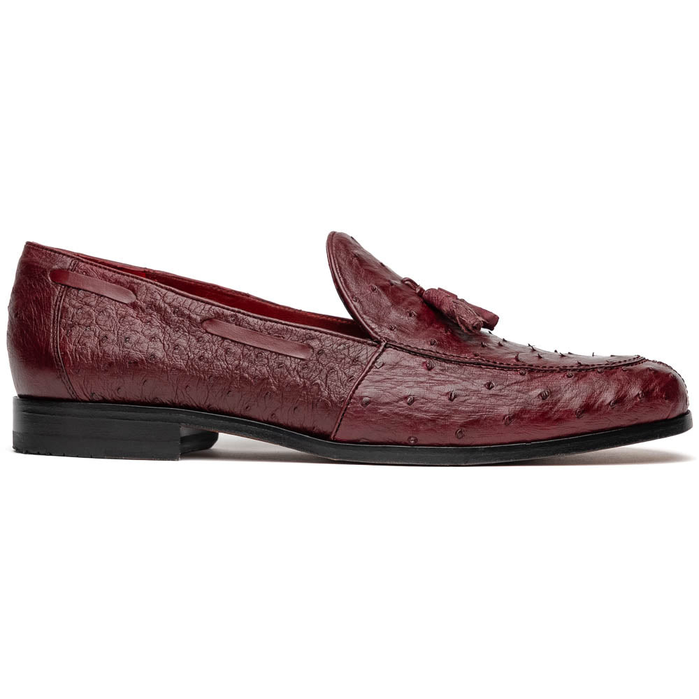 A pair of luxury Marco Di Milano Aubiere Wine loafers in burgundy ostrich leather—one upright showing tassels and quill detail, the other flipped to display the tan leather sole stamped “Marco Di Milano.”.