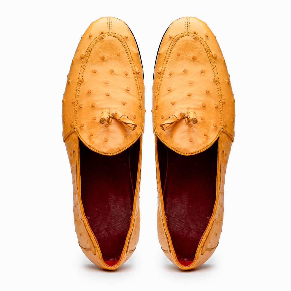 The Aubiere Buttercup by Marco Di Milano are yellow ostrich tassel loafers with red interior lining and branded leather soles, expertly crafted from genuine ostrich, presented against a white background.