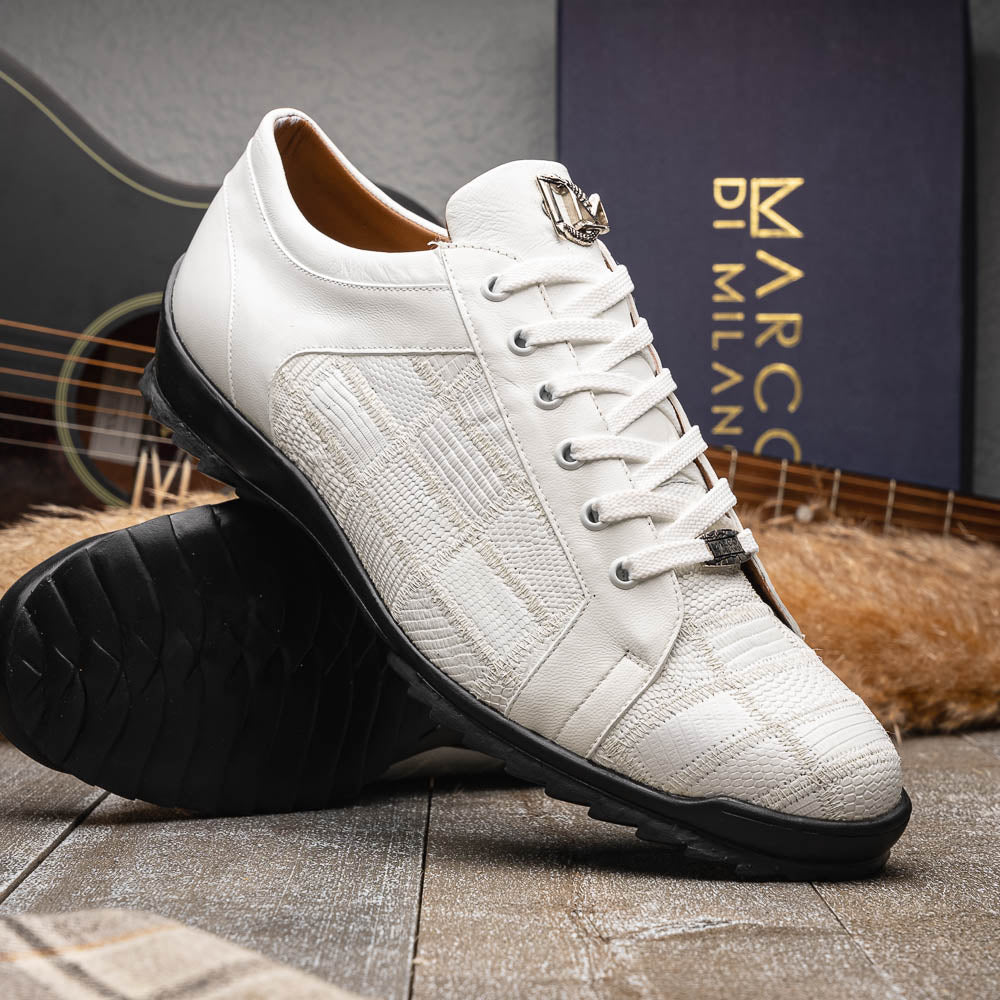 The Bari White by Marco Di Milano: white lace-up sneakers with a textured pattern, black rubber soles, and a metallic logo on the tongue. Displayed upright and angled to show the sole—luxury footwear defined.