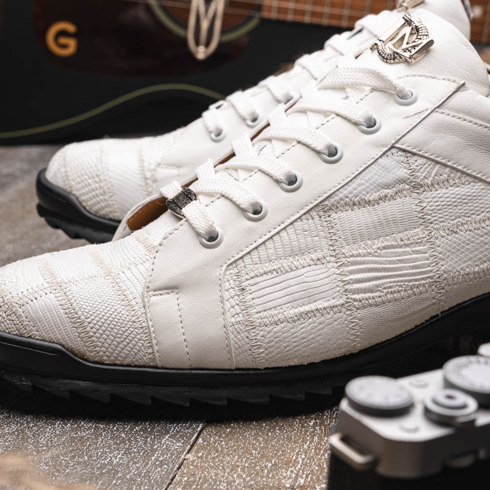 The Bari White by Marco Di Milano: white lace-up sneakers with a textured pattern, black rubber soles, and a metallic logo on the tongue. Displayed upright and angled to show the sole—luxury footwear defined.