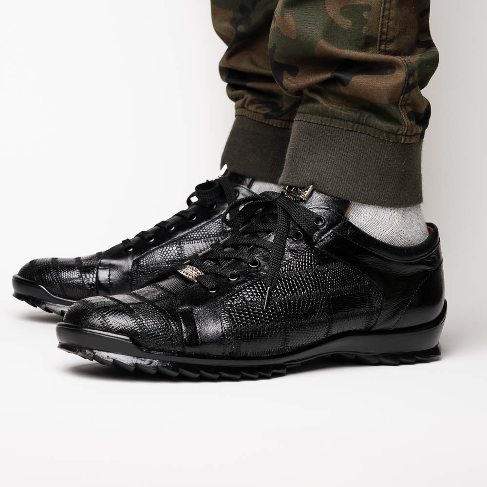 The Bari Black by Marco Di Milano: black leather lace-up dress shoes with textured detailing and a hand-painted finish; one shoe rests against the other to reveal its sole—a true statement in luxury footwear.