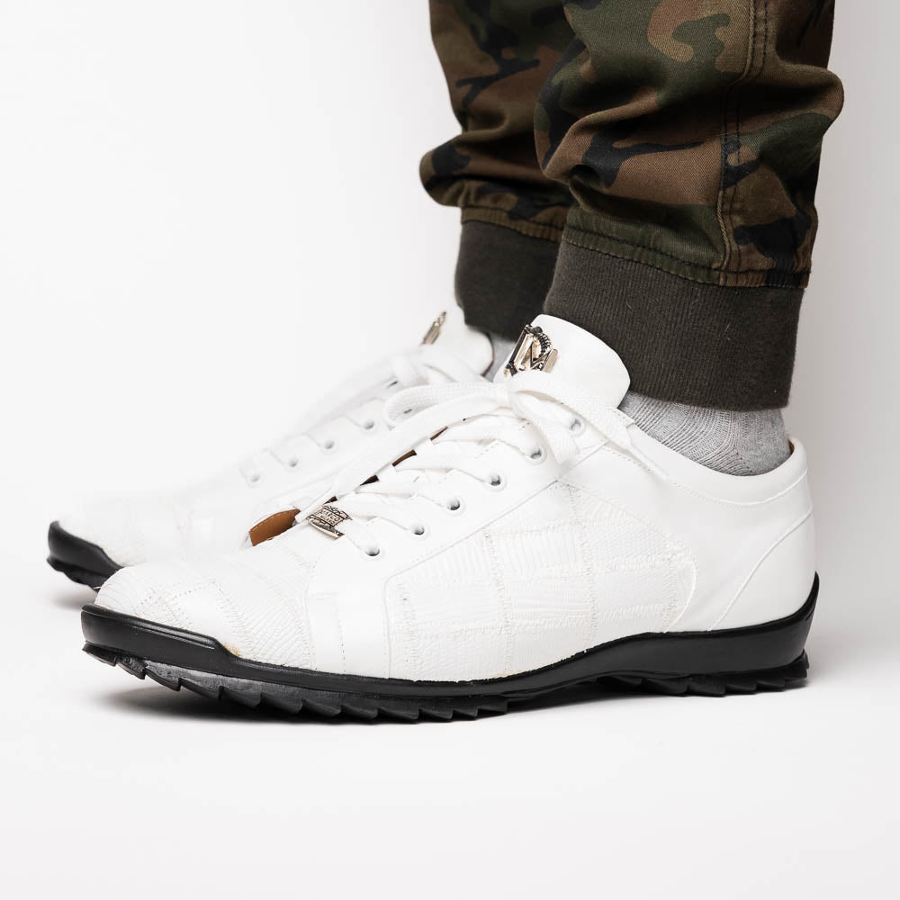 The Bari White by Marco Di Milano: white lace-up sneakers with a textured pattern, black rubber soles, and a metallic logo on the tongue. Displayed upright and angled to show the sole—luxury footwear defined.