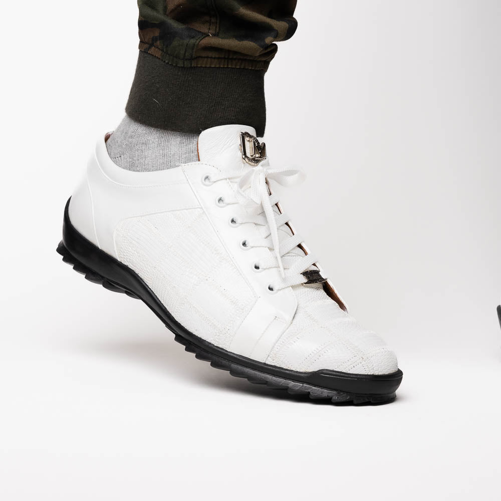 The Bari White by Marco Di Milano: white lace-up sneakers with a textured pattern, black rubber soles, and a metallic logo on the tongue. Displayed upright and angled to show the sole—luxury footwear defined.