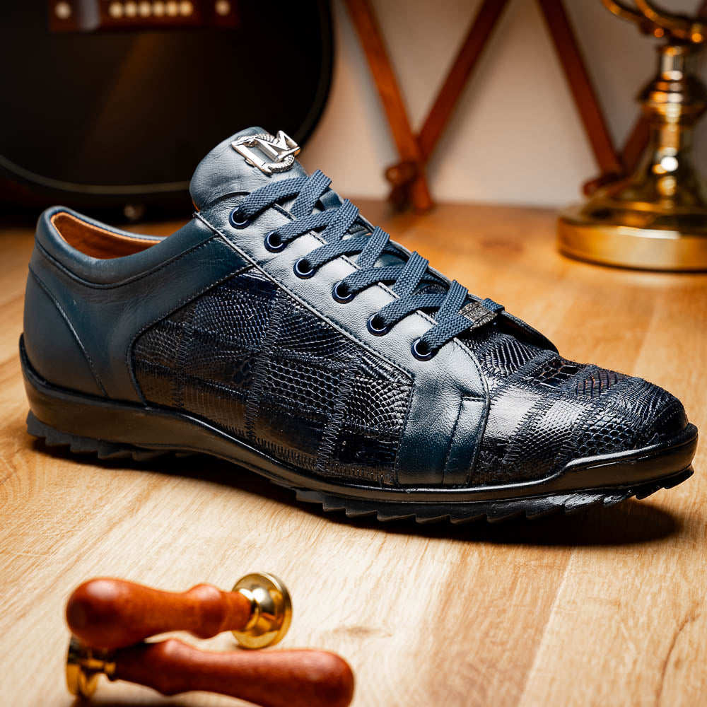 Bari Navy by Marco Di Milano: dark blue lace-up sneakers with a hand-painted finish, textured pattern, and rubber soles—one upright, one leaning. Enjoy luxury footwear designed for ultimate style and comfort.