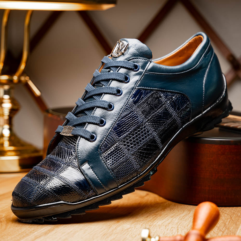 Bari Navy by Marco Di Milano: dark blue lace-up sneakers with a hand-painted finish, textured pattern, and rubber soles—one upright, one leaning. Enjoy luxury footwear designed for ultimate style and comfort.
