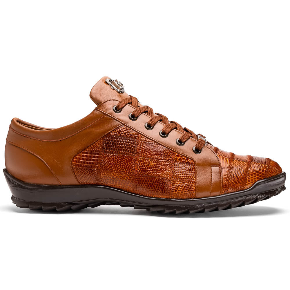 The Marco Di Milano Bari Cognac features brown leather with a hand-painted finish, textured side panels, black laces, and black rubber soles—one shoe propped against the other.