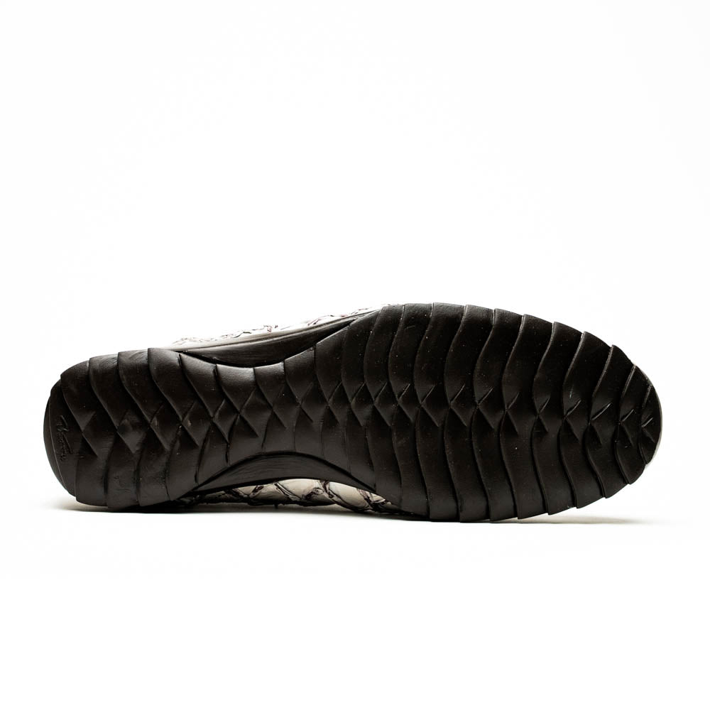 The Marco Di Milano Batistini Newspaper sneakers feature a white and grey crocodile-patterned texture, dark brown laces, and black rubber soles, showcased on a white background.