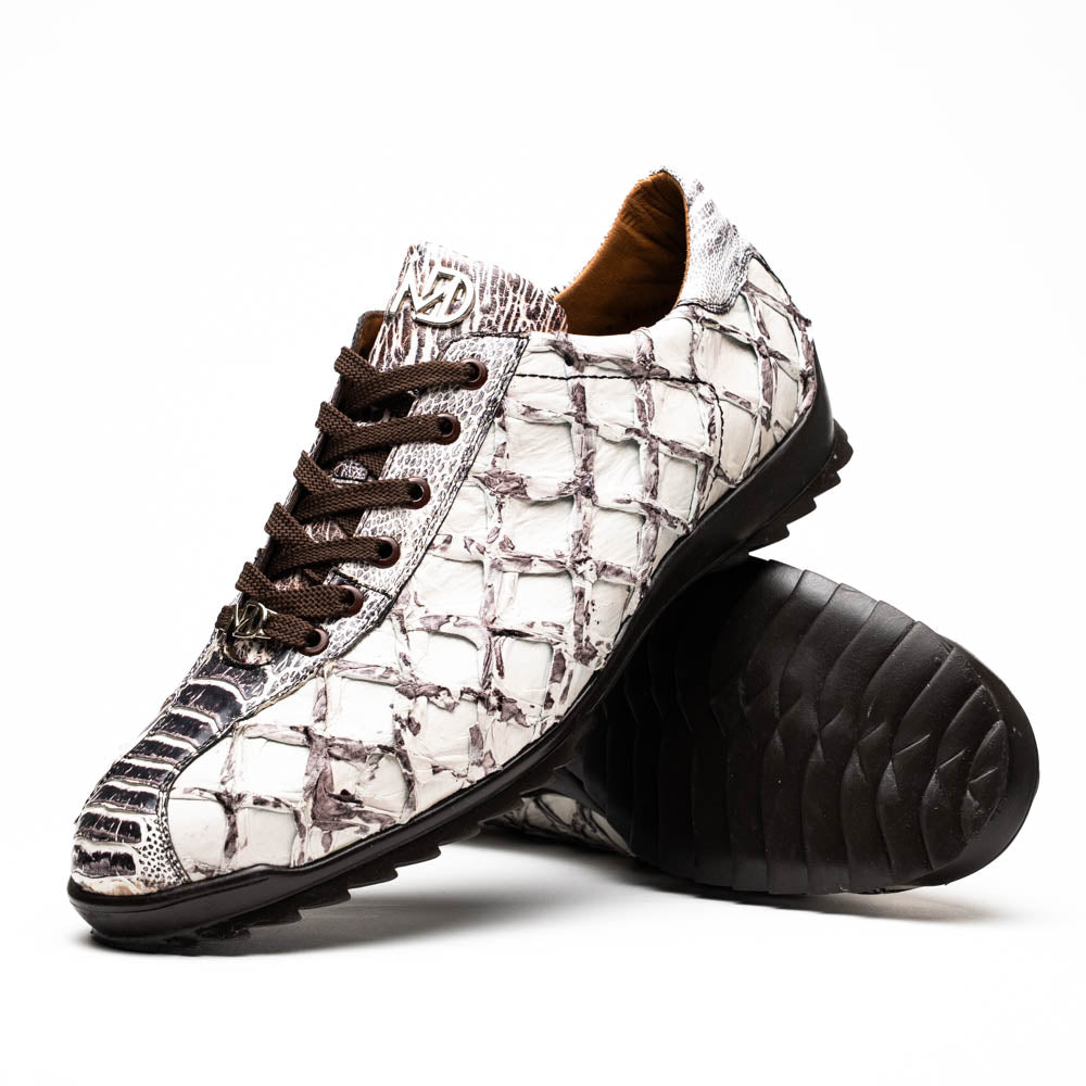 The Marco Di Milano Batistini Newspaper sneakers feature a white and grey crocodile-patterned texture, dark brown laces, and black rubber soles, showcased on a white background.