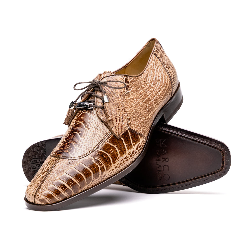A pair of Belice Rustic Orix handcrafted leather oxford dress shoes by Marco Di Milano, fashioned from tan and brown crocodile leather—one shoe stands upright while the other lies on its side, displaying the sole.