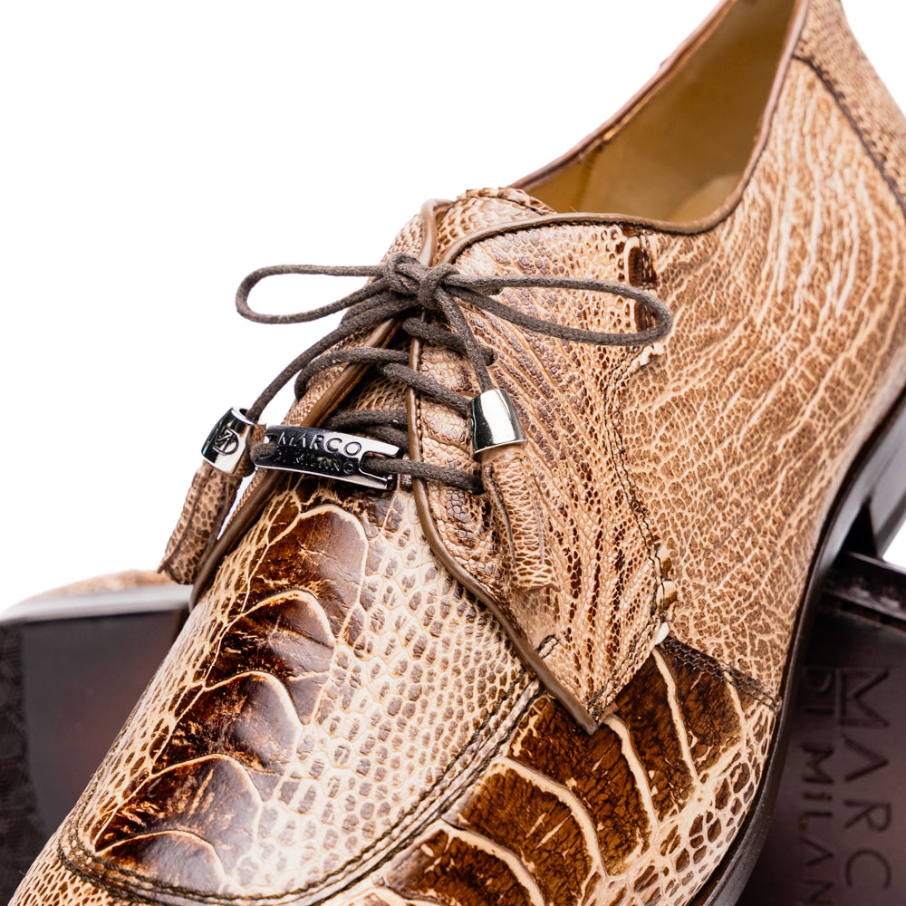 A pair of Belice Rustic Orix handcrafted leather oxford dress shoes by Marco Di Milano, fashioned from tan and brown crocodile leather—one shoe stands upright while the other lies on its side, displaying the sole.
