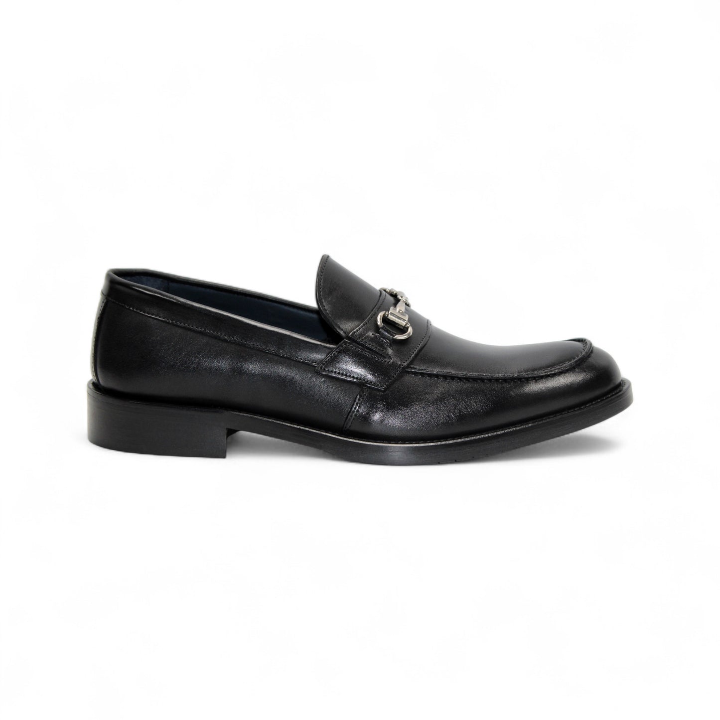 The Firmani Ben Black loafer by Firmani, made from genuine black leather, features a low heel and metal bit detail, shown in side profile against a white background for a classic modern look.