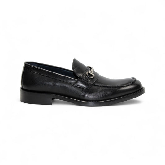 The Firmani Ben Black loafer by Firmani, made from genuine black leather, features a low heel and metal bit detail, shown in side profile against a white background for a classic modern look.