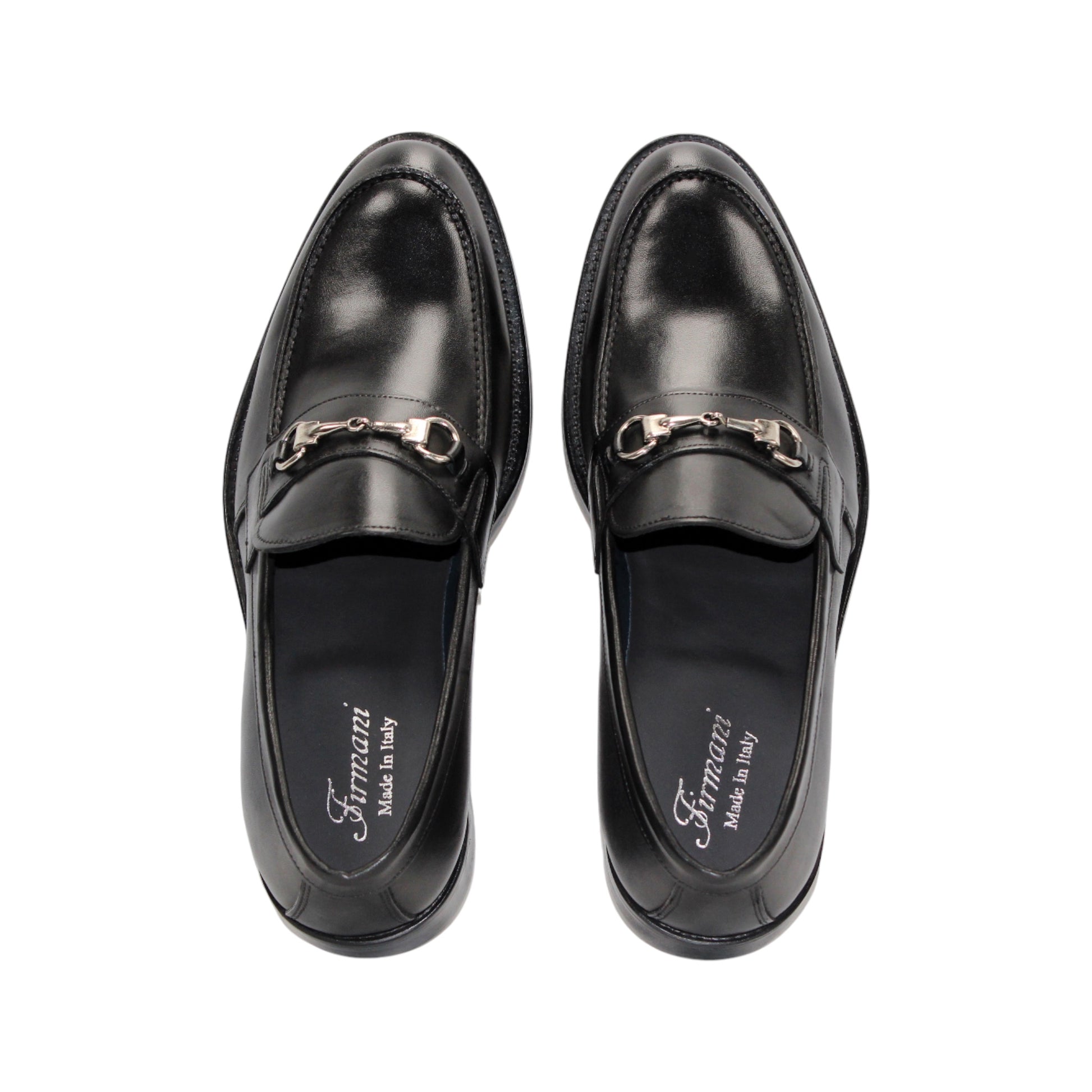 The Firmani Ben Black loafer by Firmani, made from genuine black leather, features a low heel and metal bit detail, shown in side profile against a white background for a classic modern look.
