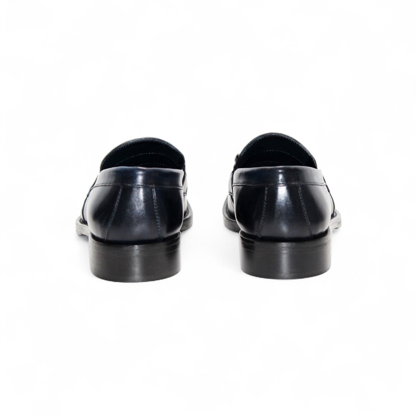 The Firmani Ben Navy by Firmani is a navy Italian leather loafer with a metal bit detail, low heel, and stitching accents, shown against a white background.