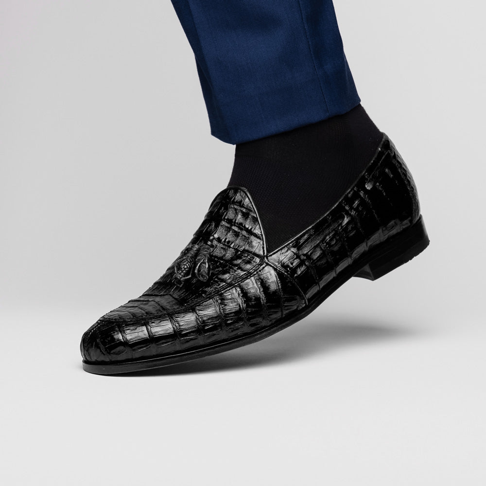 Experience luxury with the Marco Di Milano Bianchi Black—a pair of genuine caiman crocodile tassel loafers featuring black crocodile-patterned leather, red interior lining, and tan leather soles.
