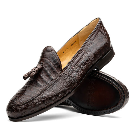 A pair of luxury men's Bianchi Brown tassel loafers by Marco Di Milano in genuine caiman crocodile—one upright, the other on its side to display the exquisite sole.